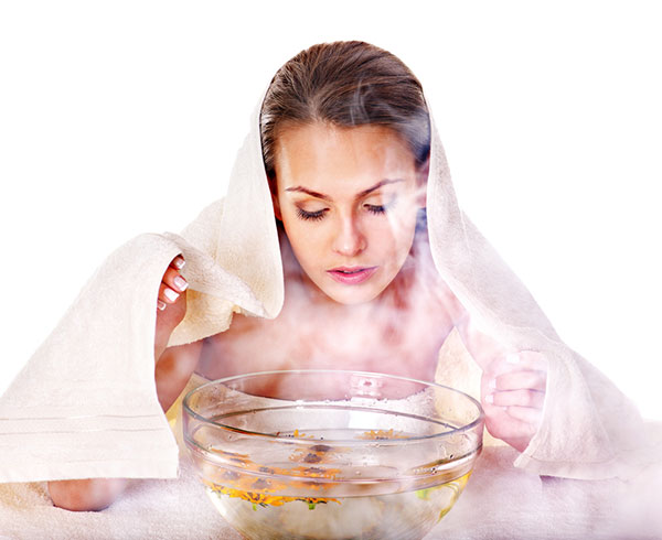 women taking face steam for blackheads